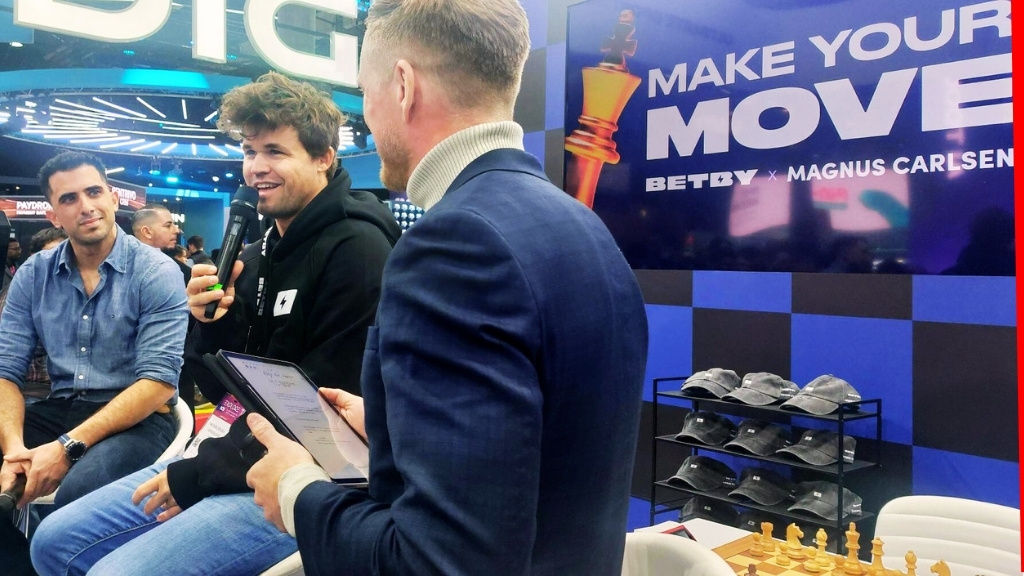 Betby and Magnus Carlsen on their winning move at ICE Barcelona