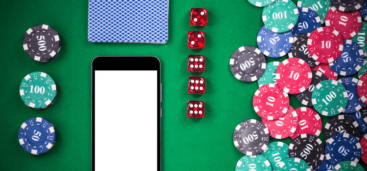 a lot of casino chips next to the smartphone